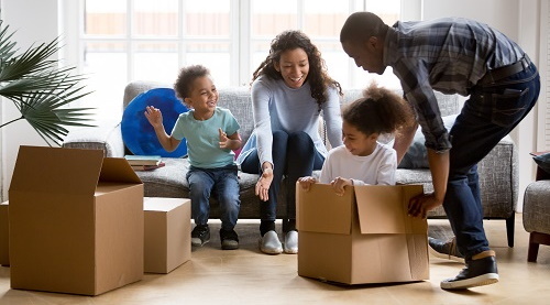 This image: A family unpacking boxes in a new home.
							 	The map:  The highlighted site at the centre of the wider Rochester county border.